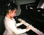 8mm_01_025_Susan playing piano - Vonnie, Rosemary